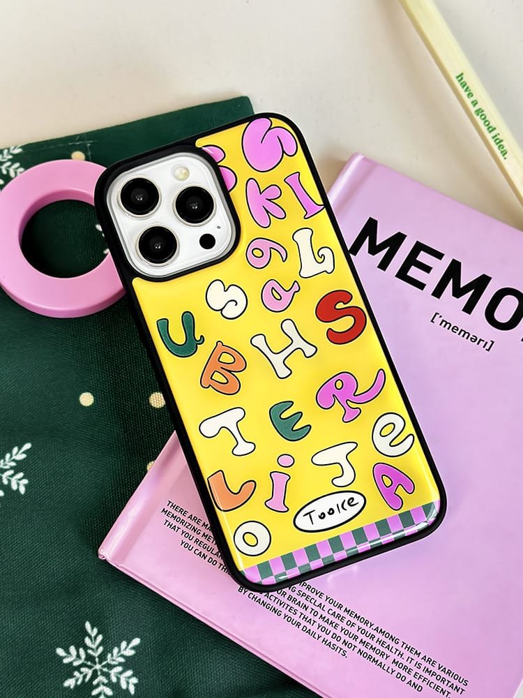 Colored letters on yellow background phone case for Apple iPhone 16 Pro Max, featuring a vibrant letter design on durable epoxy resin.