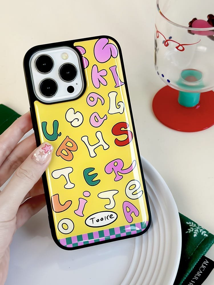 Colored letters on yellow background phone case for Apple iPhone 16 Pro Max, featuring a vibrant letter design on durable epoxy resin.