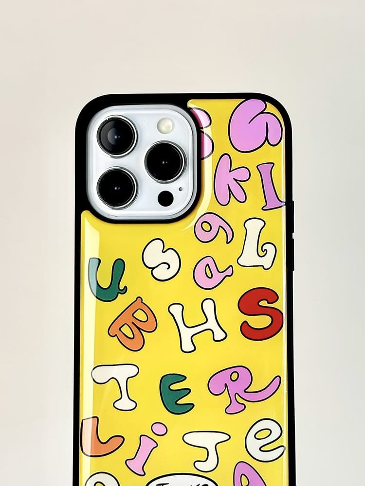 Colored letters on yellow background phone case for Apple iPhone 16 Pro Max, featuring a vibrant letter design on durable epoxy resin.