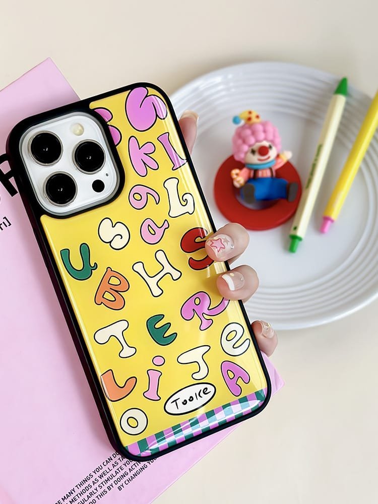 Colored letters on yellow background phone case for Apple iPhone 16 Pro Max, featuring a vibrant letter design on durable epoxy resin.