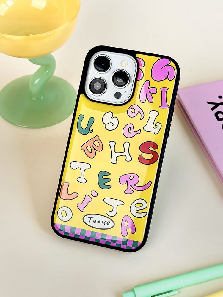 Colored letters on yellow background phone case for Apple iPhone 16 Pro Max, featuring a vibrant letter design on durable epoxy resin.